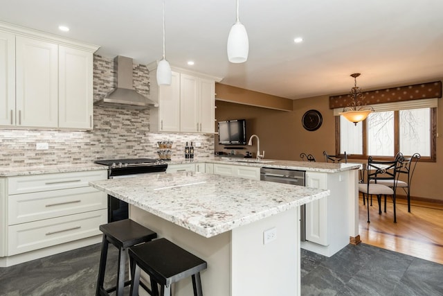 13707 W Carefree Dr, Homer Glen, IL 60491 - kitchen featuring wall chimney exhaust hood, a peninsula, a kitchen island, white cabinetry, and backsplash