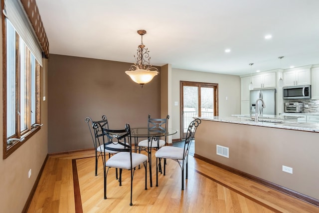 13707 W Carefree Dr, Homer Glen, IL 60491 - dining area with light wood-style flooring and recessed lighting