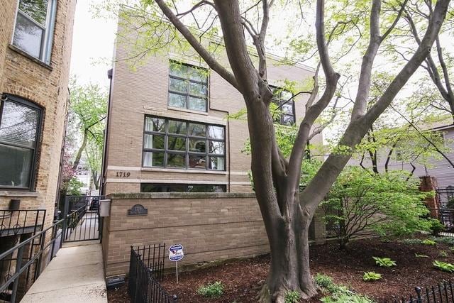 1719 N Halsted St Unit C, Chicago, IL 60614 - view of side of property with a gate and brick siding