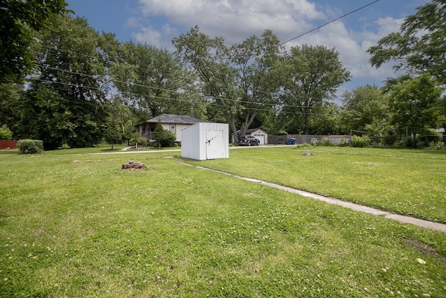 2110 E Erzinger St, Kankakee, IL 60901 - view of yard with a storage unit and view of wooded area