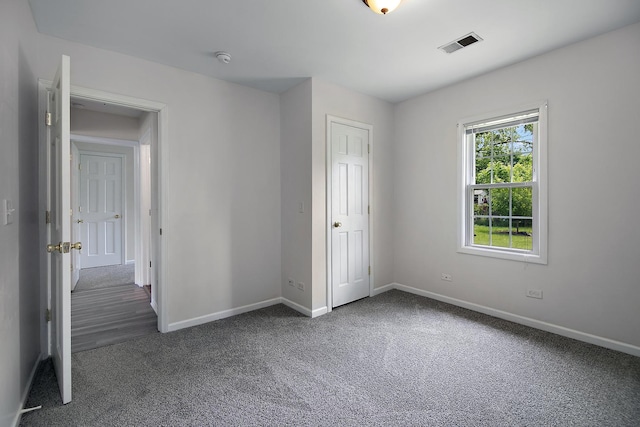 2110 E Erzinger St, Kankakee, IL 60901 - unfurnished bedroom featuring carpet and baseboards