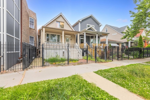 4036 N Bernard St, Chicago, IL 60618 - view of front of home featuring covered porch, a gate, and a fenced front yard