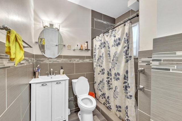 4036 N Bernard St, Chicago, IL 60618 - full bathroom with tile walls, vanity, a shower with curtain, and wainscoting