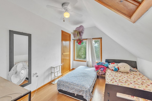 4036 N Bernard St, Chicago, IL 60618 - bedroom with lofted ceiling, light wood finished floors, and a ceiling fan