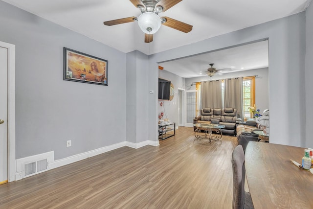 4036 N Bernard St, Chicago, IL 60618 - living area with a ceiling fan and light wood-type flooring