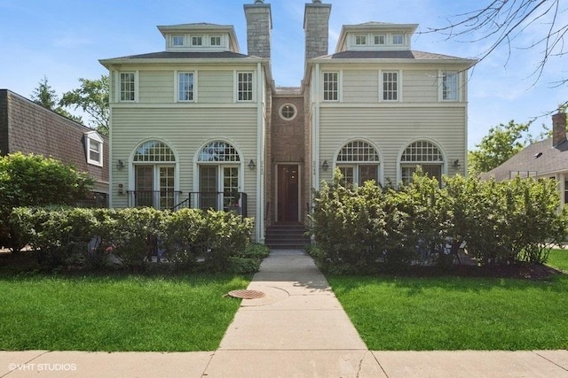 2642 Prairie Ave Unit 2, Evanston, IL 60201 - view of front facade with a front yard and a chimney