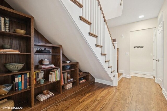2642 Prairie Ave Unit 2, Evanston, IL 60201 - stairs featuring wood finished floors, lofted ceiling, and recessed lighting