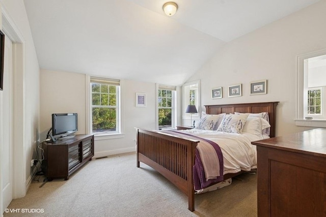 2642 Prairie Ave Unit 2, Evanston, IL 60201 - bedroom with multiple windows, vaulted ceiling, and light carpet