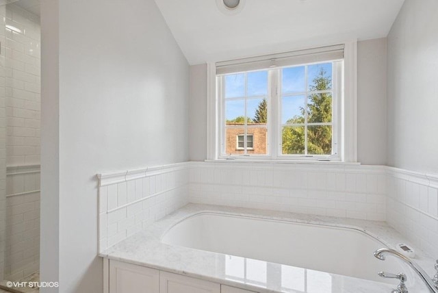 2642 Prairie Ave Unit 2, Evanston, IL 60201 - bathroom featuring healthy amount of natural light, a garden tub, and vaulted ceiling