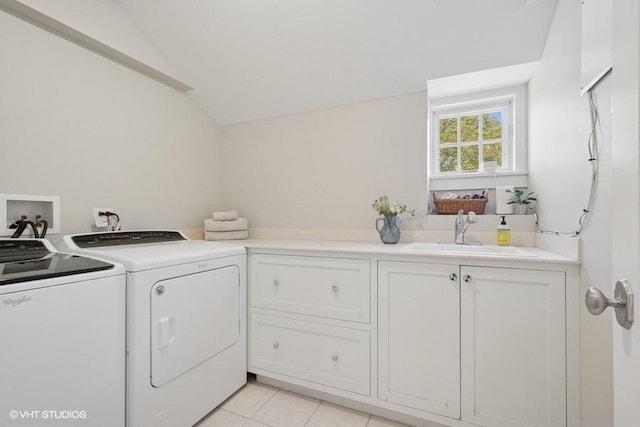 2642 Prairie Ave Unit 2, Evanston, IL 60201 - laundry room with separate washer and dryer, cabinet space, and light tile patterned flooring