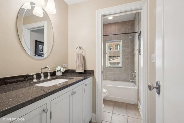 2642 Prairie Ave Unit 2, Evanston, IL 60201 - bathroom with vanity, tile patterned flooring, and bathing tub / shower combination