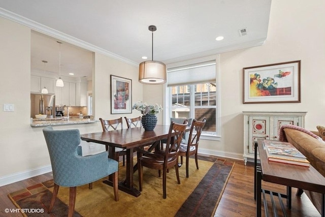 2642 Prairie Ave Unit 2, Evanston, IL 60201 - dining room featuring dark wood finished floors, ornamental molding, and recessed lighting