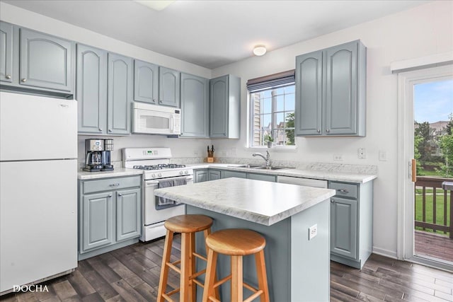 1944 Indian Hill Ln, Aurora, IL 60503 - kitchen with white appliances, gray cabinetry, and dark wood finished floors
