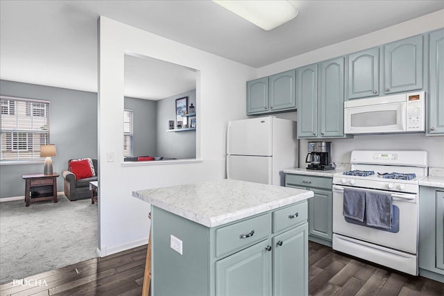 1944 Indian Hill Ln, Aurora, IL 60503 - kitchen with white appliances, dark wood-type flooring, light countertops, a center island, and blue cabinets