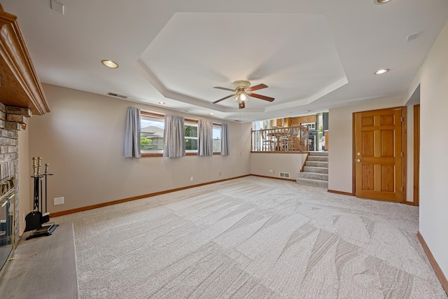 7749 W Lakeview Ter, Frankfort, IL 60423 - unfurnished living room featuring a tray ceiling, ceiling fan, recessed lighting, light colored carpet, and stairway
