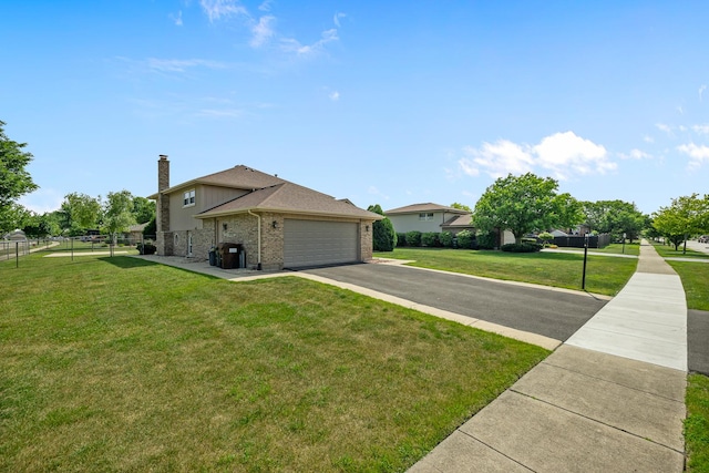 7749 W Lakeview Ter, Frankfort, IL 60423 - view of front of house with a garage, brick siding, driveway, and a chimney