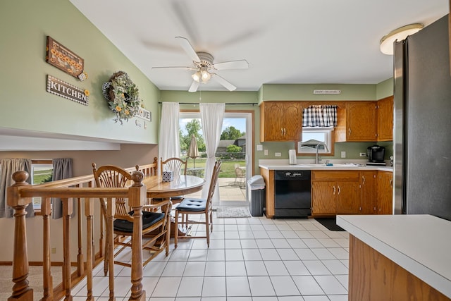 7749 W Lakeview Ter, Frankfort, IL 60423 - kitchen featuring black dishwasher, freestanding refrigerator, light countertops, a ceiling fan, and brown cabinets