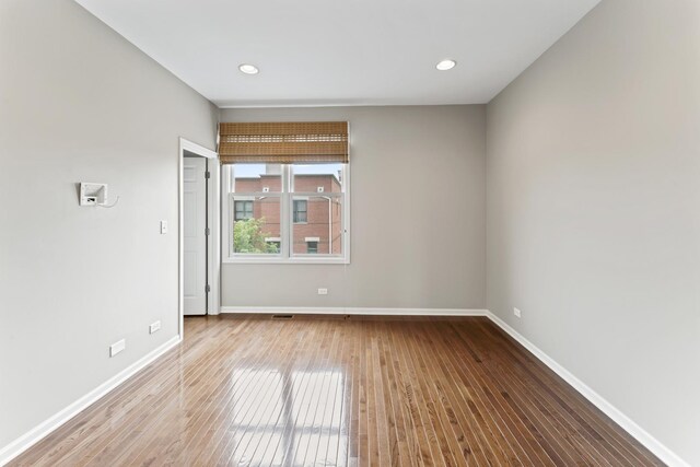 319 W Wood St Unit 18, Palatine, IL 60067 - spare room featuring hardwood / wood-style flooring and recessed lighting