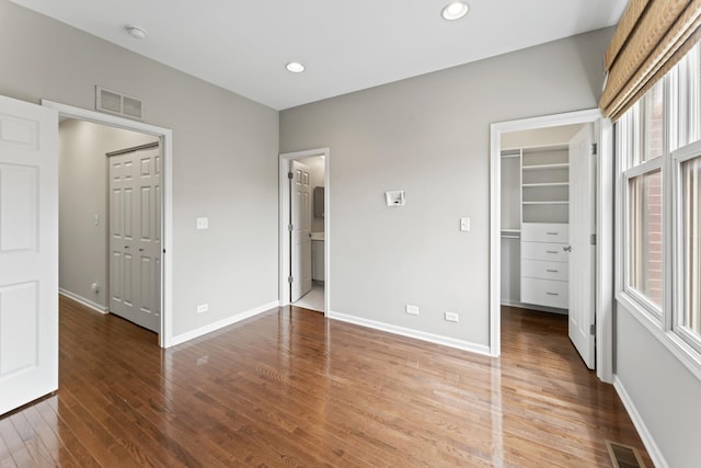 319 W Wood St Unit 18, Palatine, IL 60067 - unfurnished bedroom featuring wood finished floors, a spacious closet, a closet, and recessed lighting