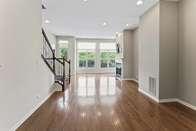 319 W Wood St Unit 18, Palatine, IL 60067 - unfurnished living room with stairway, a fireplace, dark wood-type flooring, and recessed lighting