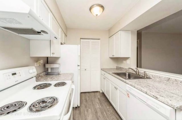633 Virginia Rd Unit 214, Crystal Lake, IL 60014 - kitchen with white appliances, light countertops, white cabinets, light wood-style floors, and under cabinet range hood