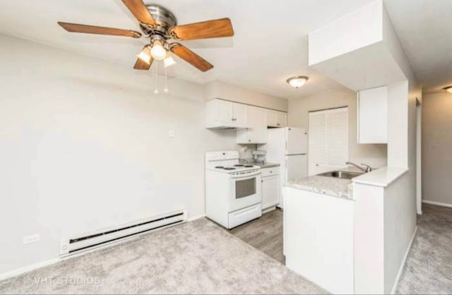 633 Virginia Rd Unit 214, Crystal Lake, IL 60014 - kitchen featuring white appliances, a baseboard heating unit, white cabinets, and light countertops