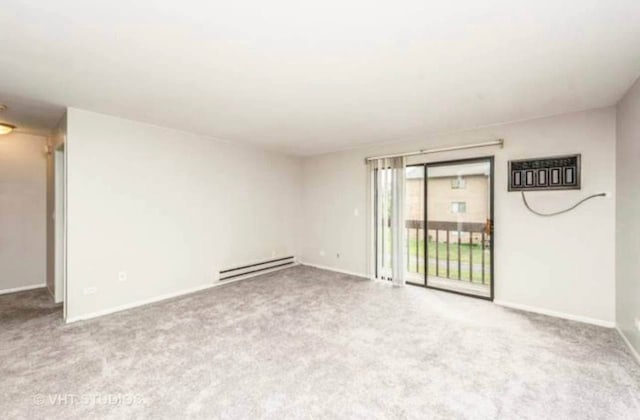 633 Virginia Rd Unit 214, Crystal Lake, IL 60014 - carpeted spare room with a baseboard radiator and baseboards