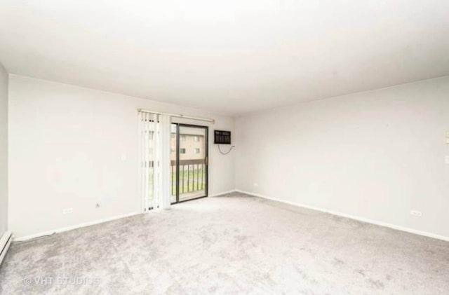 633 Virginia Rd Unit 214, Crystal Lake, IL 60014 - empty room with light carpet and a baseboard heating unit