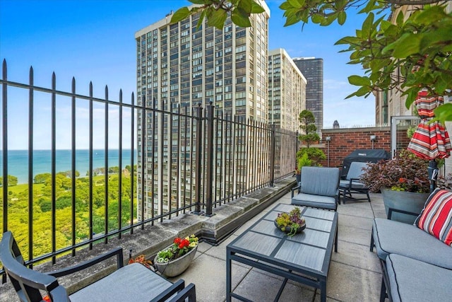 5510 N Sheridan Rd Unit 17A, Chicago, IL 60640 - view of patio featuring outdoor lounge area, a water view, and a grill