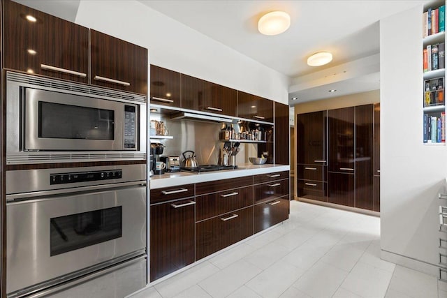 5510 N Sheridan Rd Unit 17A, Chicago, IL 60640 - kitchen with appliances with stainless steel finishes, open shelves, modern cabinets, and light countertops