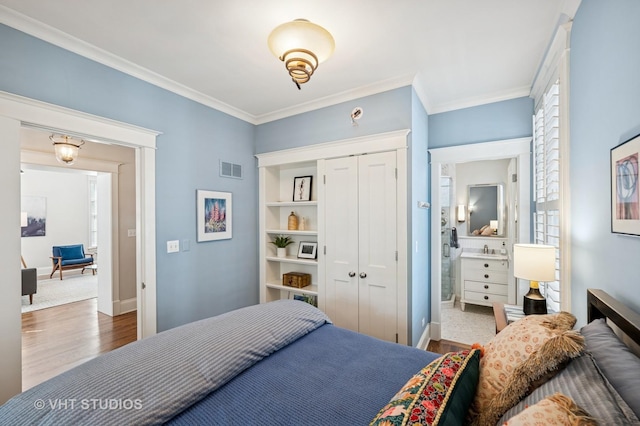 625 Park Ave, Wilmette, IL 60091 - bedroom with wood finished floors, crown molding, and a closet
