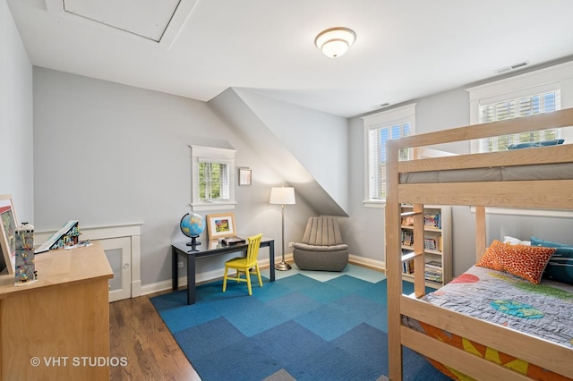 625 Park Ave, Wilmette, IL 60091 - bedroom featuring multiple windows and dark wood-type flooring