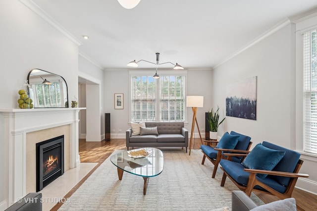 625 Park Ave, Wilmette, IL 60091 - living room with healthy amount of natural light, wood finished floors, ornamental molding, and a premium fireplace