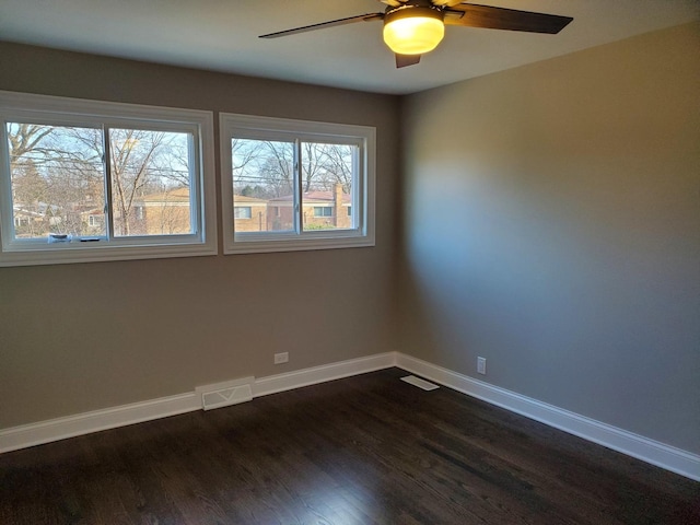 542 Laramie Ave, Wilmette, IL 60091 - empty room featuring a ceiling fan and dark wood-style flooring