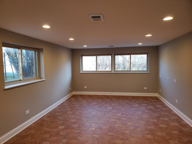 542 Laramie Ave, Wilmette, IL 60091 - unfurnished room with recessed lighting and dark stone finish flooring