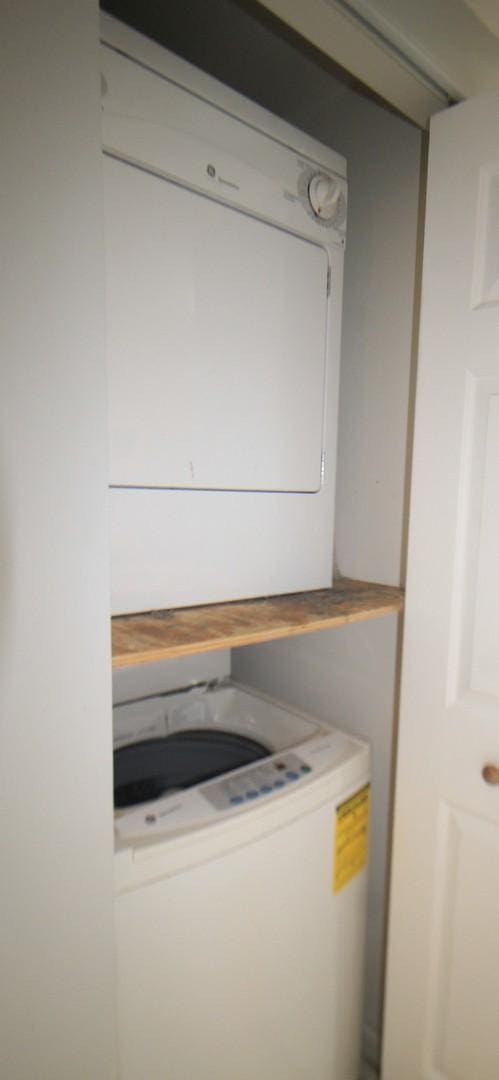 7335 Oakwood Ave Unit 4F, Lyons, IL 60534 - laundry room featuring stacked washing machine and dryer