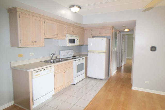 7335 Oakwood Ave Unit 4F, Lyons, IL 60534 - kitchen featuring white appliances, light countertops, light brown cabinets, and light wood finished floors