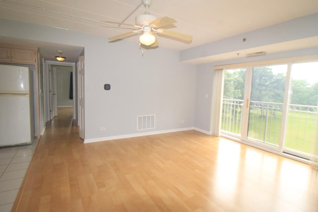 7335 Oakwood Ave Unit 4F, Lyons, IL 60534 - empty room with light wood-style flooring and a ceiling fan