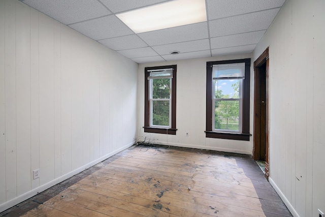 125 S Main St, Clifton, IL 60927 - unfurnished room featuring hardwood / wood-style floors and a paneled ceiling