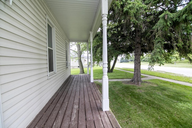125 S Main St, Clifton, IL 60927 - wooden porch with a yard