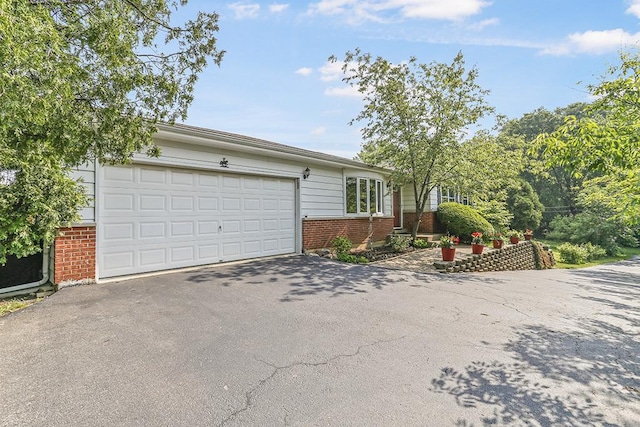 15005 131st St, Lemont, IL 60439 - view of front facade with brick siding, asphalt driveway, and a garage