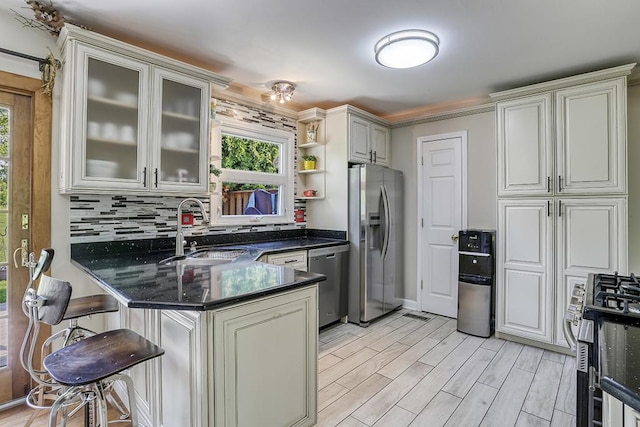 15005 131st St, Lemont, IL 60439 - kitchen with stainless steel appliances, a sink, a peninsula, decorative backsplash, and open shelves
