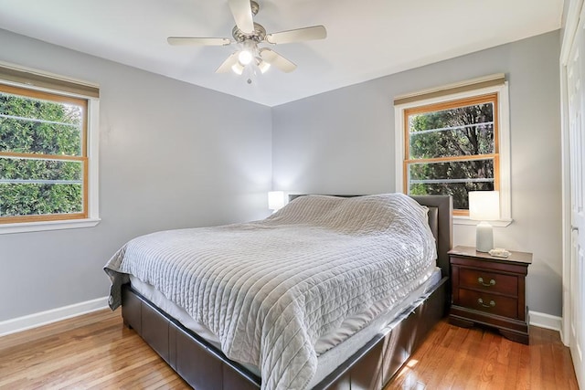 15005 131st St, Lemont, IL 60439 - bedroom featuring baseboards, light wood-type flooring, and ceiling fan