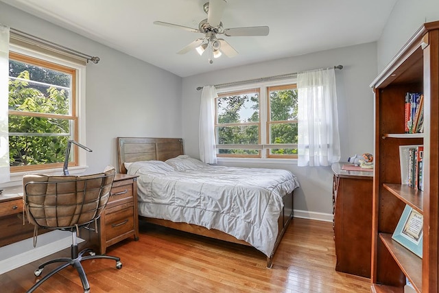 15005 131st St, Lemont, IL 60439 - bedroom with light wood-type flooring, baseboards, and ceiling fan