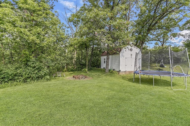 15005 131st St, Lemont, IL 60439 - view of grassy yard with a trampoline and a fire pit