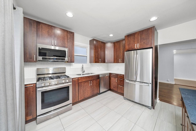 3100 N Newcastle Ave, Chicago, IL 60634 - kitchen with appliances with stainless steel finishes, recessed lighting, light countertops, and tasteful backsplash