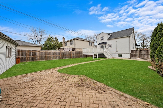 3100 N Newcastle Ave, Chicago, IL 60634 - rear view of property with a fenced backyard, a patio, and a deck