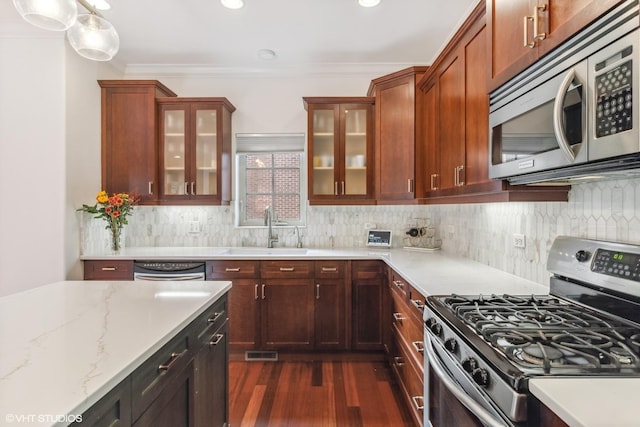 3019 W Cornelia Ave, Chicago, IL 60618 - kitchen with stainless steel appliances, dark wood-style flooring, glass insert cabinets, tasteful backsplash, and light stone countertops
