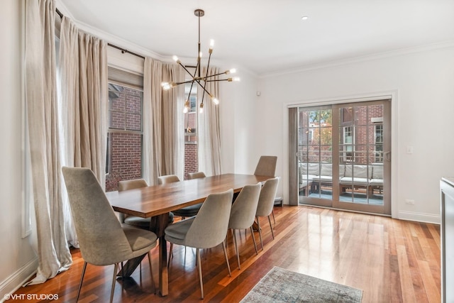 3019 W Cornelia Ave, Chicago, IL 60618 - dining space with a chandelier, crown molding, and wood finished floors