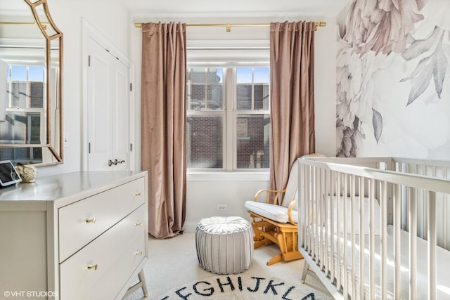 3019 W Cornelia Ave, Chicago, IL 60618 - bedroom featuring multiple windows, a crib, and light carpet